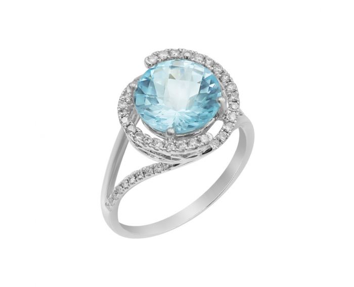 White gold ring with diamonds and topaz