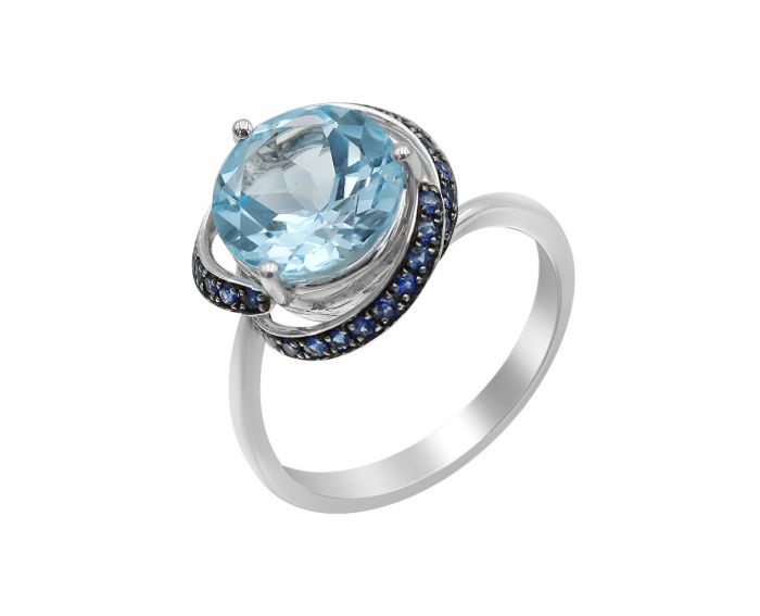 White gold ring with sapphires and topaz