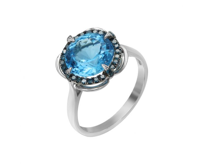 White gold ring with diamonds and topaz