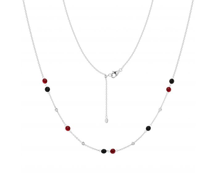 Transformer necklace with diamonds, rubies and onyx in white gold