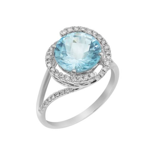 White gold ring with diamonds and topaz