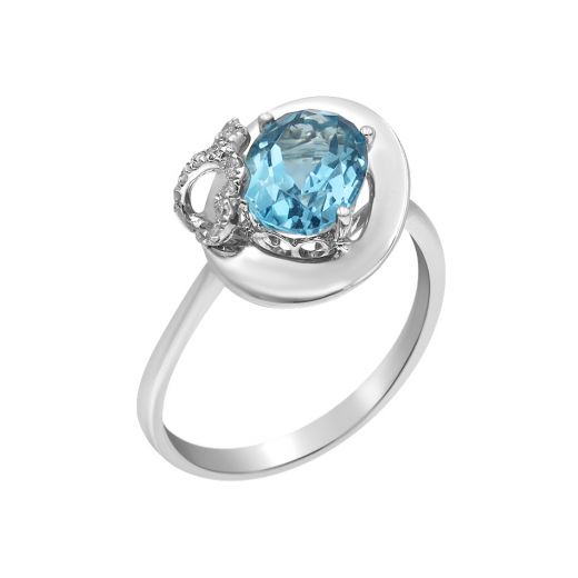 White gold ring with diamonds and topaz