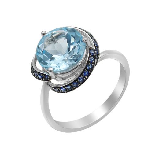 White gold ring with sapphires and topaz