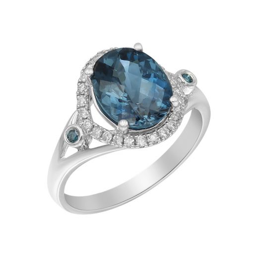 White gold ring with diamonds and london blue topaz