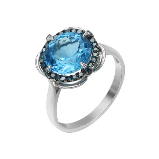 White gold ring with diamonds and topaz