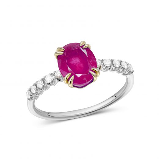 A ring with a ruby and diamonds in a combination of white and yellow gold