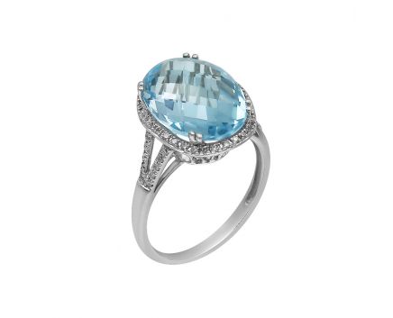 White gold ring with diamonds and topaz