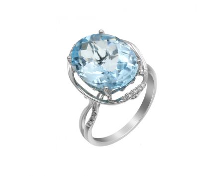 White gold ring with diamonds and topaz