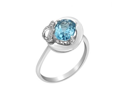 White gold ring with diamonds and topaz