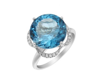 White gold ring with diamonds and london blue topaz