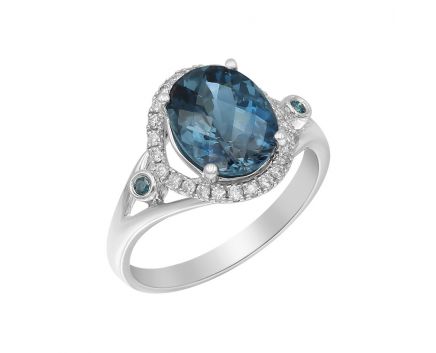 White gold ring with diamonds and london blue topaz