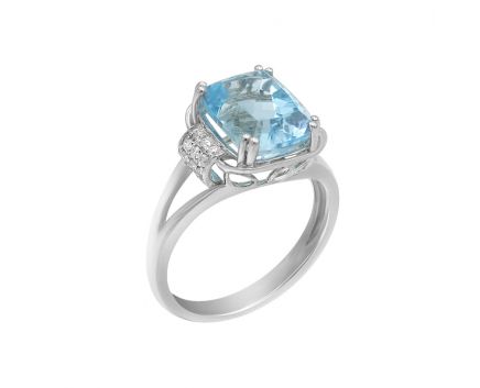 White gold ring with diamonds and topaz