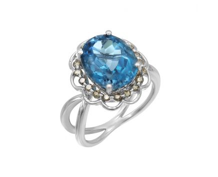 White gold ring with diamonds and topaz