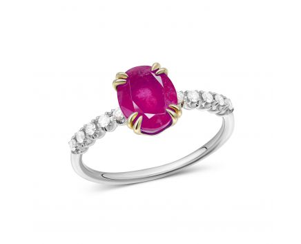 A ring with a ruby and diamonds in a combination of white and yellow gold