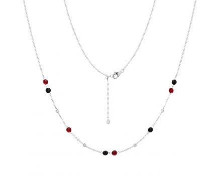 Transformer necklace with diamonds, rubies and onyx in white gold