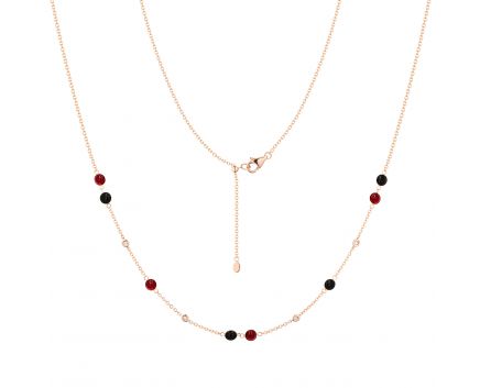 Necklace with diamonds, rubies and onyx